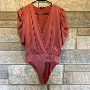 Worn once! Beautiful and sexy bodysuit.